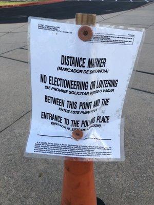 Cone at corner of school marking where political ads & advocacy must cease