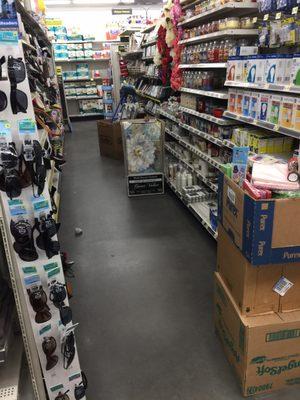 Displays and stacks of cases litter the aisles