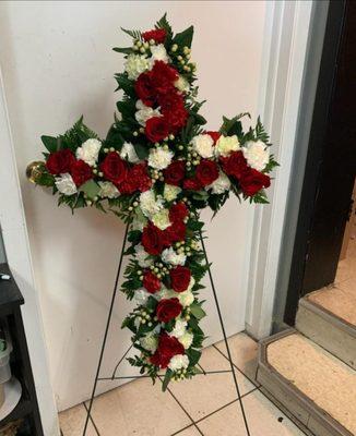 $298.  Love and Prayers sympathy  cross arrangement ordered through their website for a funeral service in June 2021