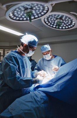 Dr. Norman Rowe & Dr. Charles Pierce in surgery