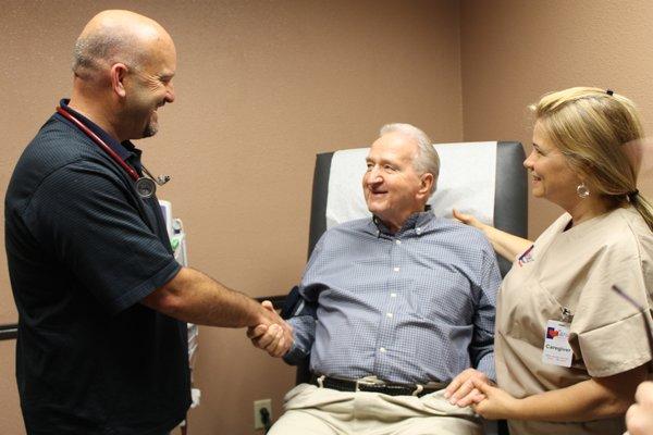 Caring Senior Service caregiver attending a doctor visit with a client