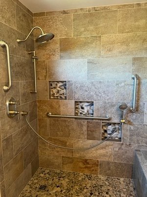 Shower with handheld shower bar, rain head shower, grab bar and seat