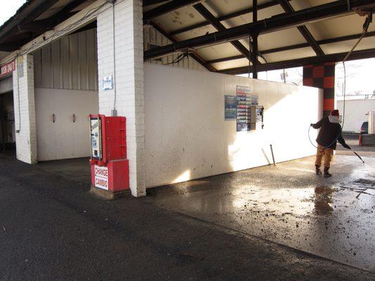 Employee cleaning the wash bays