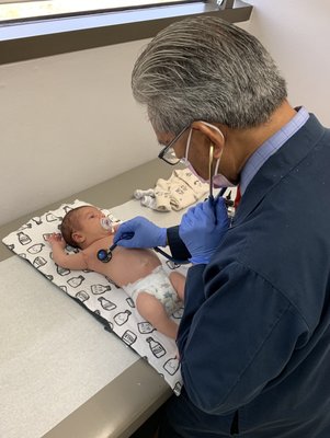 Dr. Edralin checking on our newborn