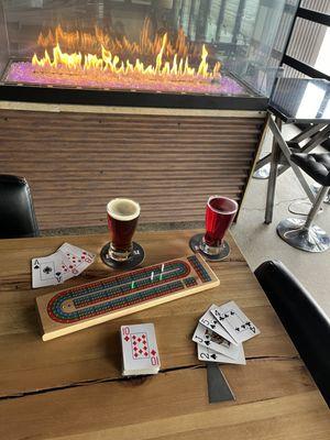 A game of cribbage by the fireplace