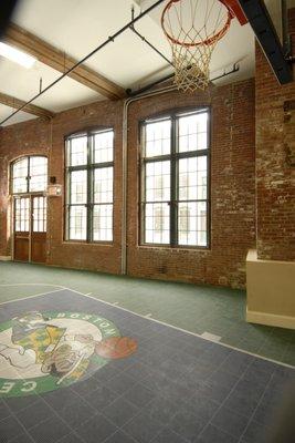 Shoot some hoops on the indoor basketball court.