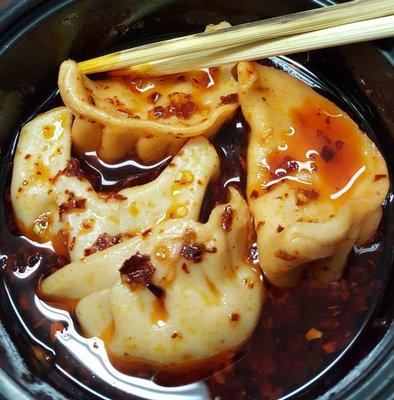 Close up of my special request! Dumplings in a spicy oil sauce! So good! 2 thumbs up!