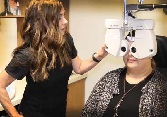 Dr. Hamilton performing a comprehensive eye exam.