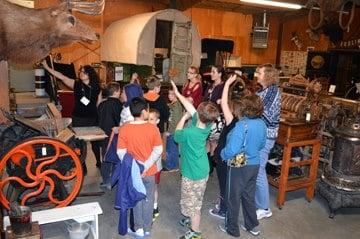 School tours in our "garage" gallery, which is full of historic transportation artifacts and more.