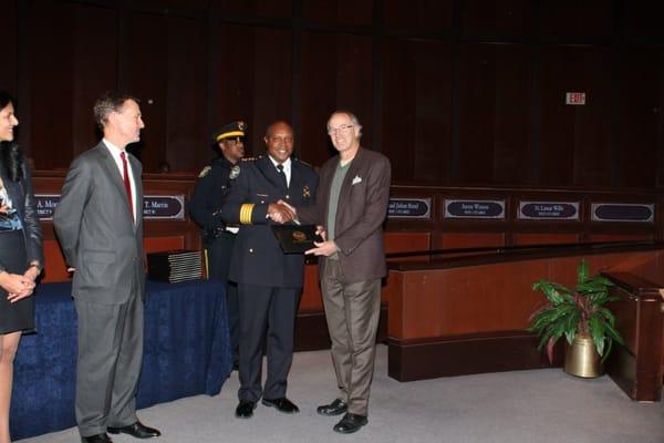 Being presented with Graduation Certificate by Police Chief George Turner