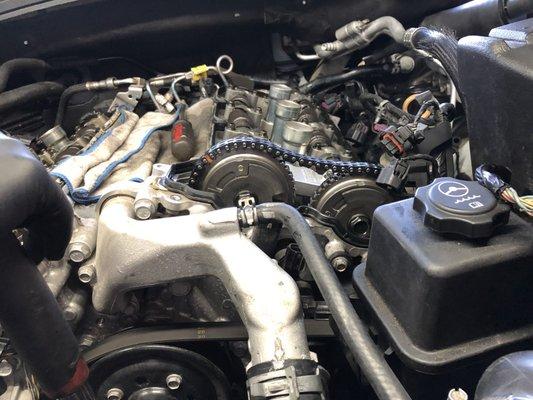 Working at timing chain front a Chevy camaro