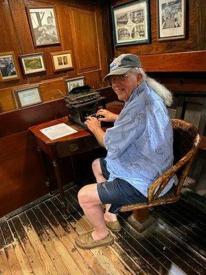 Typing a Yelp review at Hemingway's desk aboard the Pilar