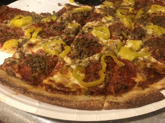 Pizza and sausage New York style (cut into squares and banana peppers added at home before baking were my choices). Tasty!