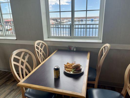 Cheeseburger and fries with a beer, overlooking the marina