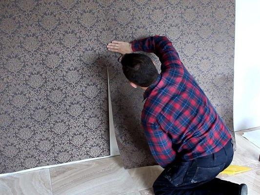 wallpapering on the wall