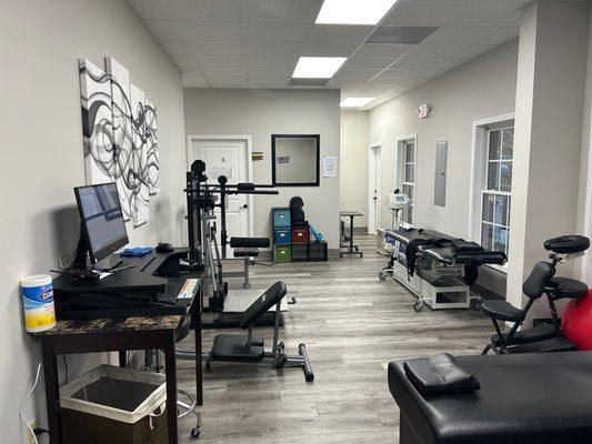 Full spinal rehab suite including decompression tables, massage chairs, lumbopelvic rehab equipment, cervical rehab equipment.