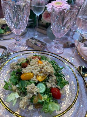 Mixed greens and quinoa salad in a pineapple balsamic vinaigrette