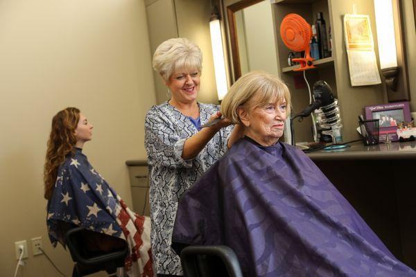 A resident gets her hair styled in our on-site beauty salon.