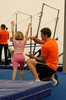 Coach Luke spots stations during the Beginner Girls class.