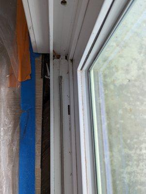 Two inch gap left between floor boards and slider frame. Dirty slide track left after job.