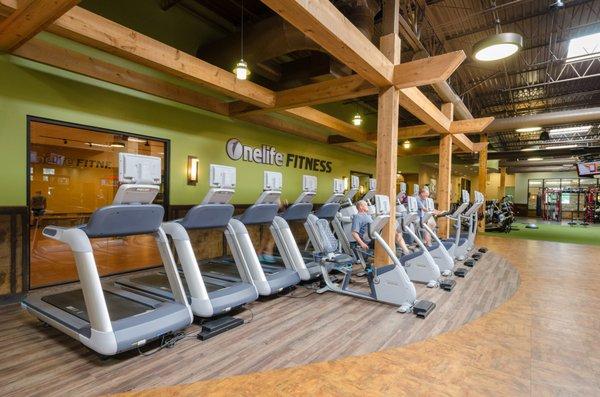 Open workout spaces and individual televisions on cardio