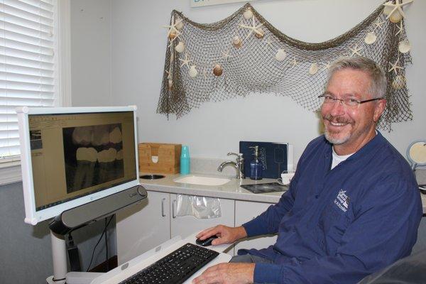 Dr. Kitzmiller with chair-side technology