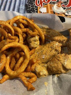 Cajun ranch chicken wings with curly fries. Delicious!