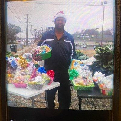 Spunky D with his handmade Christmas fruit baskets from 2020.