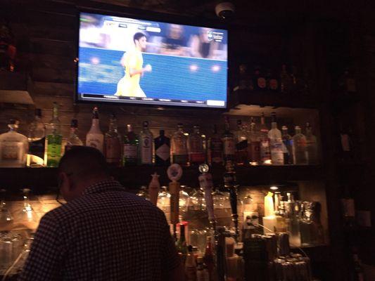 Tv playing soccer in the bar