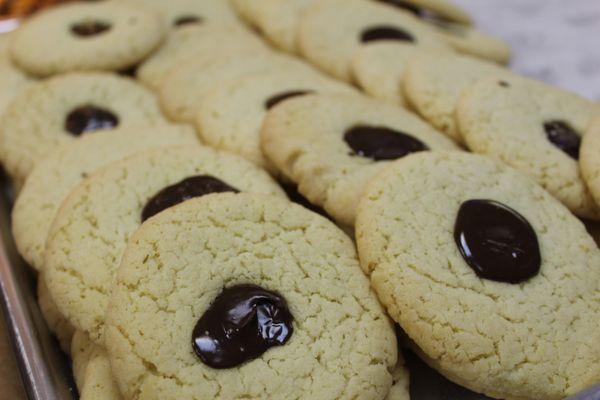 Sugar cookies topped with a dollop of chocolate