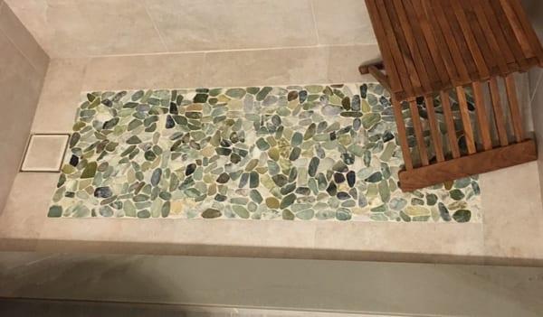 Green pebble shower floor with hidden drain!