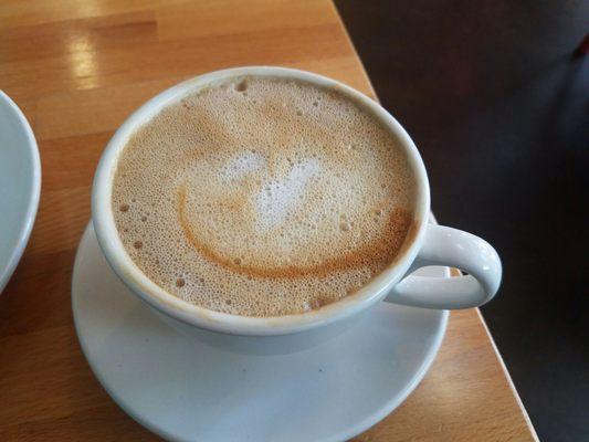 That is an almond milk cappuccino (12 ozs)? Looks improper, & no art work on it either