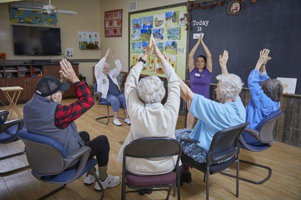 Chair yoga activity.  Keeping people moving!