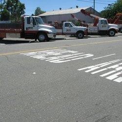 Flatbed and low over tow truck