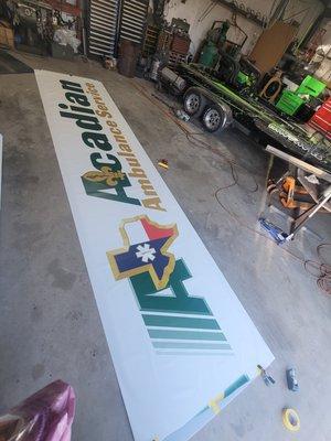 Getting a lit sign prepped for installation.