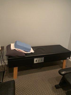 Heated massage bed