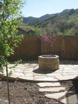 backyard flagstone patio and natural gas firepit