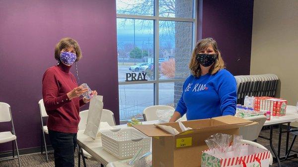 Volunteers and staff prepare for kids Christmas event