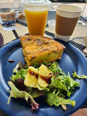 Bacon and sausage egg quiche with coffee and freshly squeezed OJ