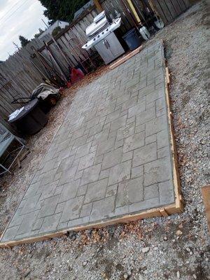 Patio finished with a aggressive multi size brick stamp