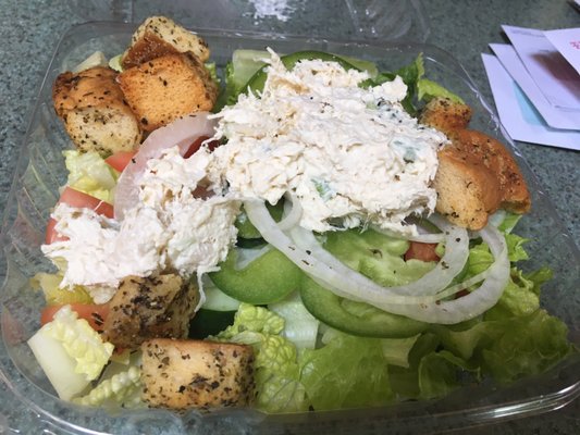 Chicken topped salad.