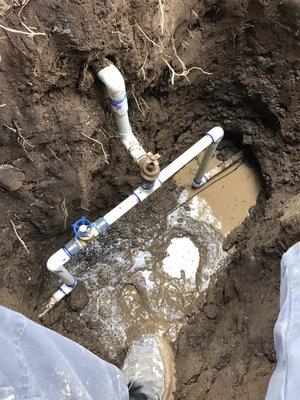 Four and a half foot deep water main valves brought up to a standard depth. Muddy but got r done.