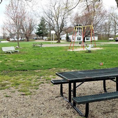 bench and picnic table near the playground