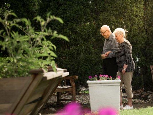 Couple Walking in Courtyard at Kingston Residence of Perrysburg