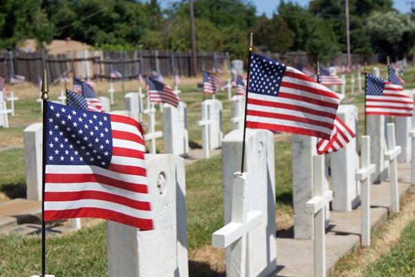 Crosses and flags on each veteran grave in honor of Veteran's Day