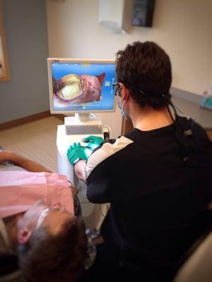 Dr. Miskovich working with the latest in technology on the Cerec Machine.