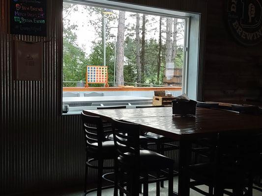 view of the large patio & a giant connect 4 game