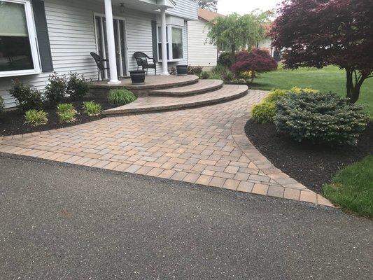 Free form steps  with walkway to front entrance