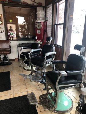 Waiting area in old barber shop chairs