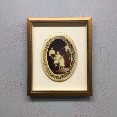 Early 20th century enamel "button" family portrait in a custom shadow box  frame.